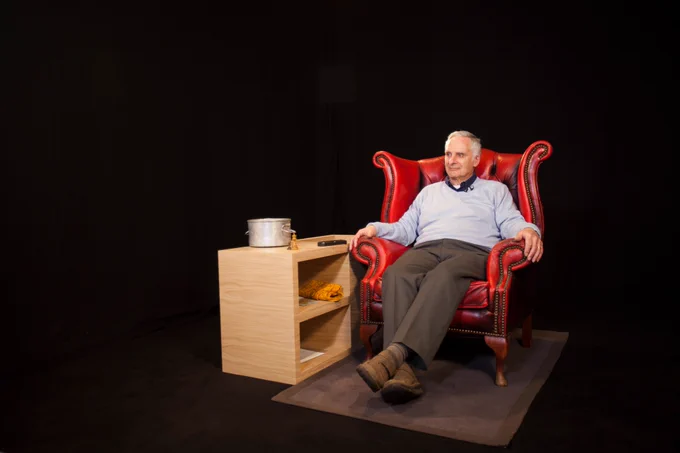Steven Frank, Holocaust survivor preparing to record, in a red chair