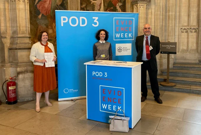 Ruth Edwards (Con MP for Ruddington), at BGS' Evidence Week stand with Dr Corinna Abesser and Dr Andrew Bloodworth. The stand (Pod 3) is blue, with a white and red Evidence Week logo. 