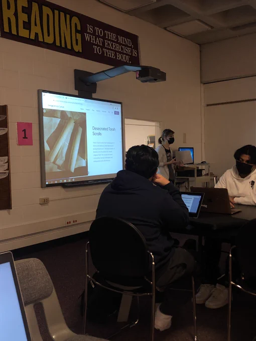 Mrs. Faile presents the virtual field trip of the Holocaust Memorial Museum