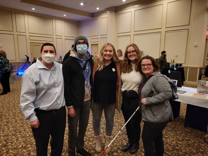 Dr. Perry and 4 students in the FSU Visual Disabilities Program pose for a picture after a successful Dining in the Dark experience!