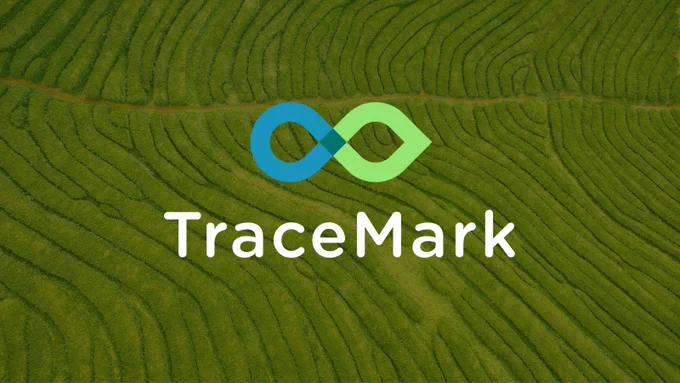 An aerial image of a tea plantation with the TraceMark logo superimposed atop 