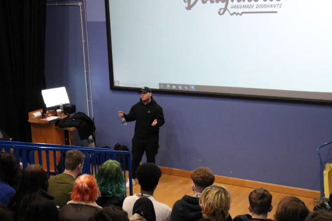 Doughnotts CEO Wade Smith talking to a audience of creative media students