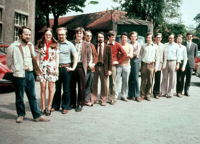 Gerhard Ertl research group in Hanover in summer 1973, from left: Johannes Tornau, Mathilde Monika Plancher-Hollemann, Otmar Schober, Gerold Doyen, Germann, Klaus Wandelt, Klaus Christmann, Jürgen Koch, Horst Conrad, Ernst-Eberhard Latta, Gerhard Ertl, Jürgen Küppers, H.-Friedhelm Kempin, and Manfred Neumann. Picture by courtesy of Klaus Wandelt, as printed in the “Lives in Chemistry” book Gerhard Ertl, My Life With Science (2021), p. 37.