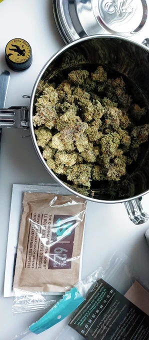 2 liter stainless vault half filled with cannabis