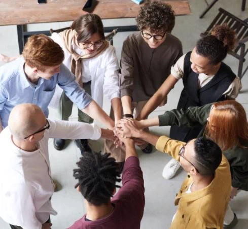 Photo by Fauxels photographer - In this picture has people holding each other's hands while making a circle