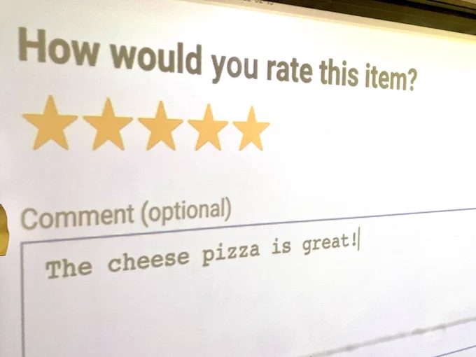 Food review form. Top text reads: How would you rate this item? Five stars shaded yellow with a comment that reads, “The cheese pizza is great!”