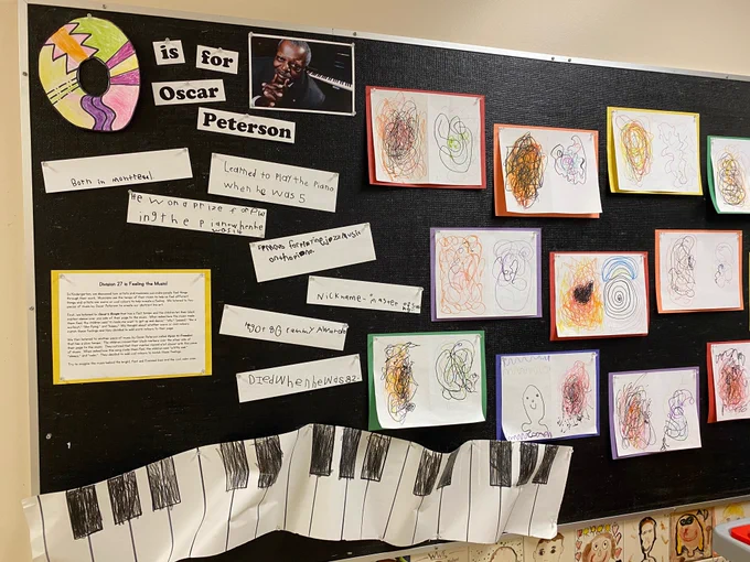 Bulletin board with writing and drawings related to Oscar Peterson. 
