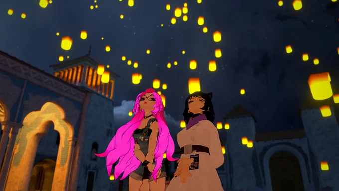 A still from "We Met in Virtual Reality." Two figures—one has long, hot pink hair and wearing short overalls, and the other has short black hair, animal ears, and is wearing a long, beige coat—are standing in a nighttime outdoor scene, with fiery floating lanterns and castle architecture behind them.