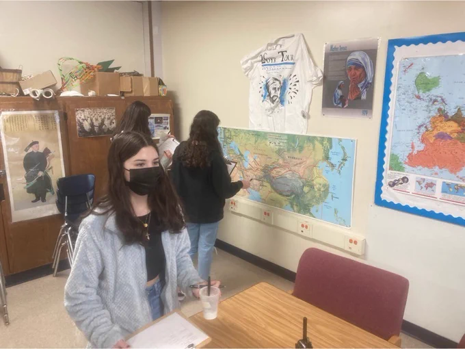 students checking maps