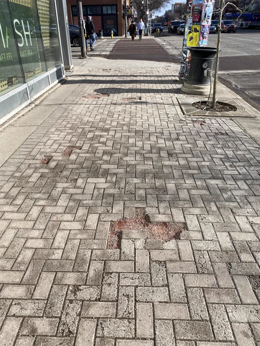 Broken pavers on sidewalk