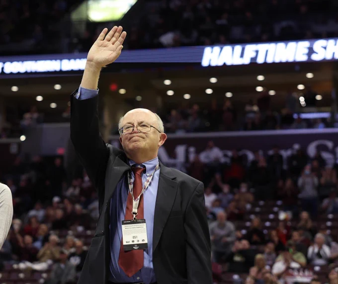Art Hains waves to the crowd