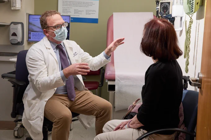 Dr. Jon Koff meets with patient. Photo by Robert Lisak