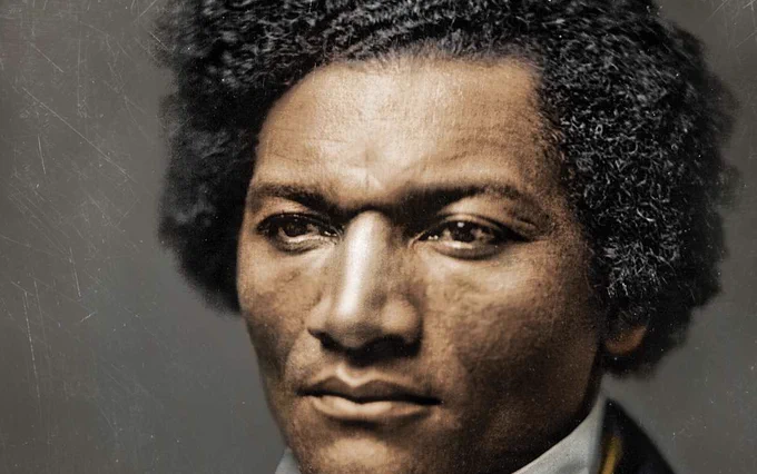 A vivid portrait of Frederick Douglass as a young man. He's dressed in a collar and is looking just off-camera with a pensive expression.