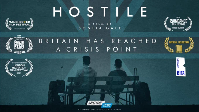 Poster for the Hostile Documentary by Sonita Gale, with the tagline 'Britain has reached a crisis point' with a photo of the backs of two young men with suitcases, on a ricketty park bench, with a faded Union Jack flag as the background. The edges of the image are filled with film awards the documentary has been nominated for.