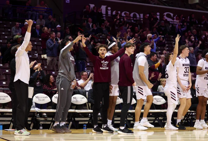 The bench cheers a basket