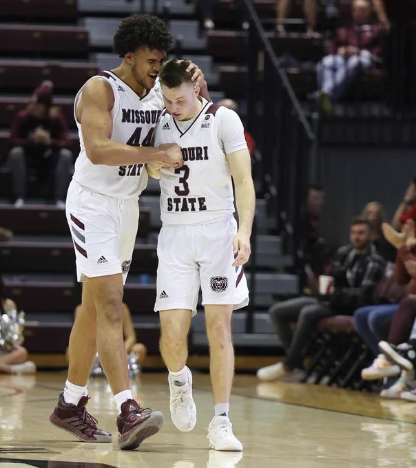 Gaige Prim embraces Isaiah Haney