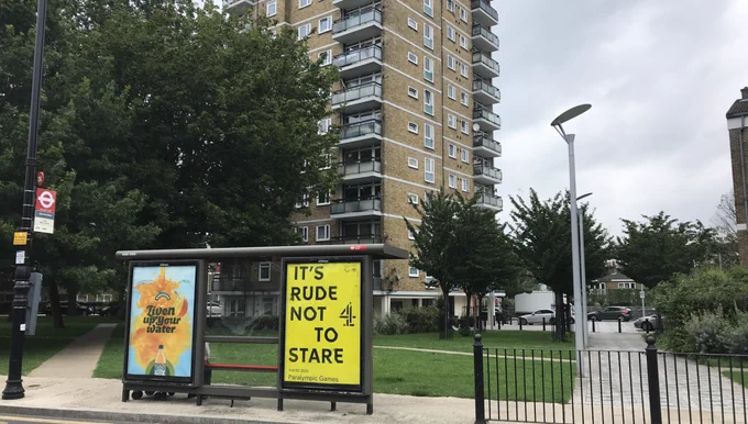Bus stop with Channel 4's Paralympic advert saying 'It's rude not to stare'