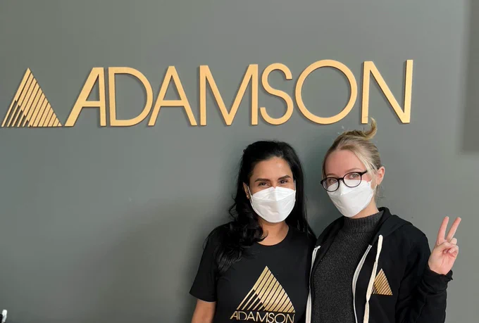 Two employees at Adamson Systems Engineering.