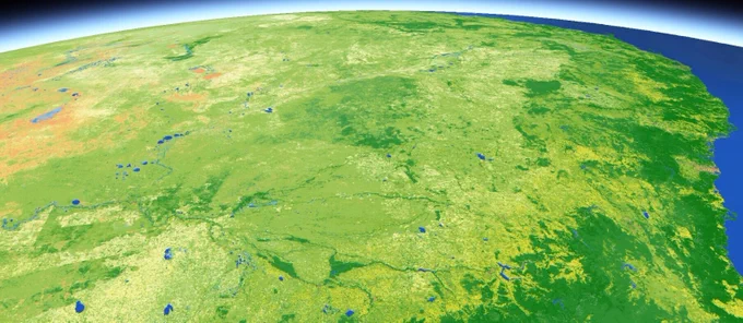 A DEA Land Cover map of Eastern Australia, showing how the physical attributes of the surface change. This image is predominately shades of green, indicating vegetation, with some orange to the west, indicating bare. To the east there is blue to denote the ocean. The image appears to be taken from space, with some atmospheric detail in the background.
