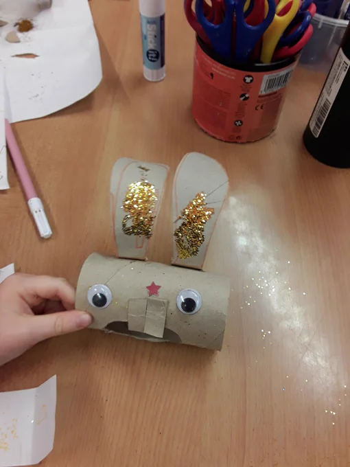 Rabbit craft made of toilet roll, glitter, and googly eyes