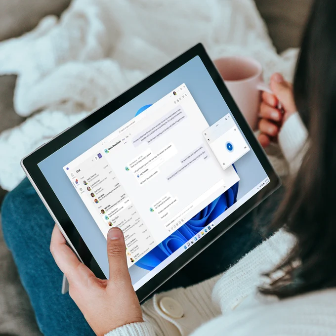 A person using a tablet computer to send chat messages.

