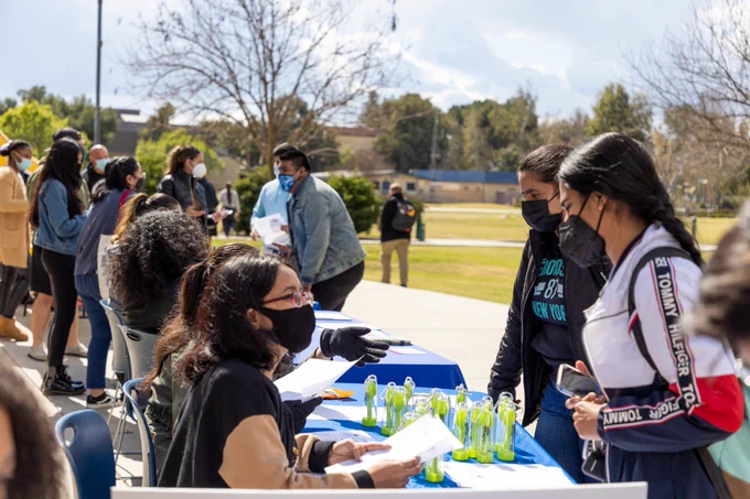 Students receiving information during CSUB CalFresh resource fair.