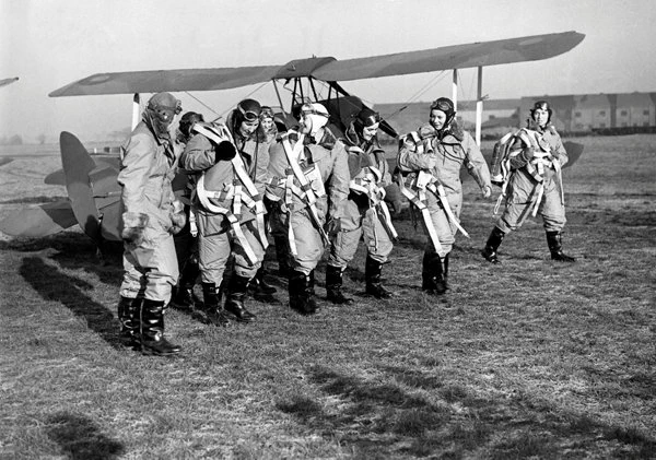 Image shows a group of Air Transport Auxiliary women pilots photographed in their flying kit at Hatfield, Hertfordshire, on 10 January 1940.
