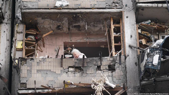 An elderly woman is seen amid rubbles after a missile struck a residential building during Russias military intervention in left bank Kyiv, Ukraine on February 25, 2022