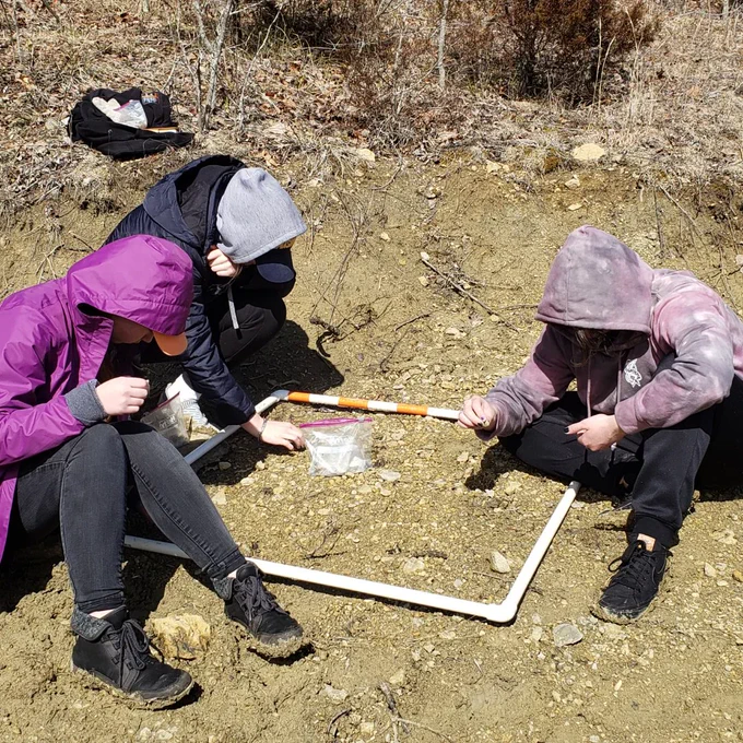 students around quadrat