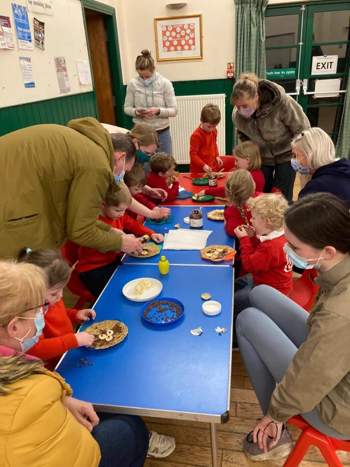 Squirrel Scouts making pancakes with bananas and chocolate spread