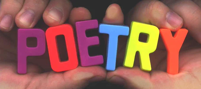 Photograph of two hands holding rainbow colored letter magnets spelling out the word POETRY.
