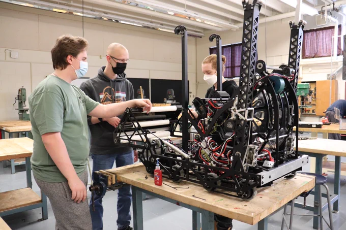 Students and mentors working together on the competition robot.