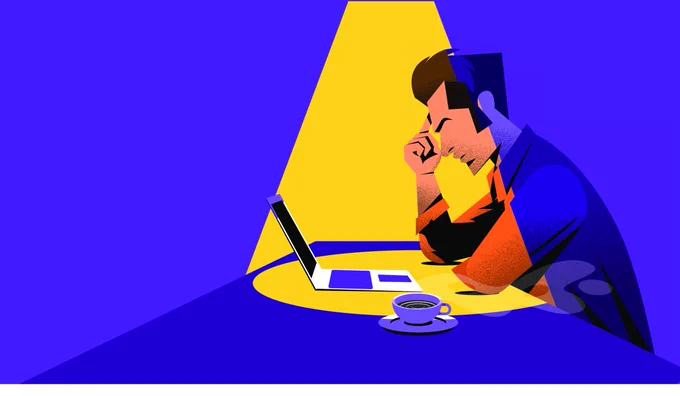 A graphic showing a man, with his right-hand index finger touching his right temple, looking into his laptop screen on a table that has also a tea cup on a saucer. The laptop and the man's face are highlighted by an overhead spotlight.