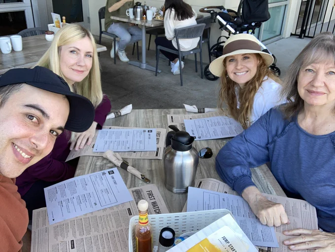 Me, Jon, my mom and sister at an outdoor patio for breakfast
