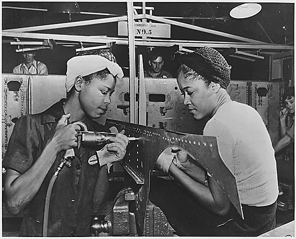 Luedell Mitchell and Lavada Cherry are shown in the El Segundo Plant of the Douglas Aircraft Company during World War II.