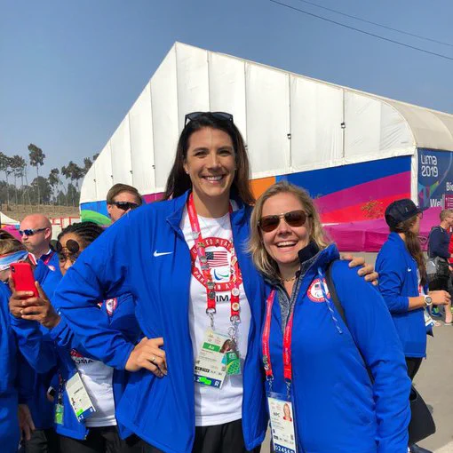 USOPC CEO Sarah Hirshland poses with sitting volleyball player Katie Holloway Bridge at the Lima Pan American Games.  