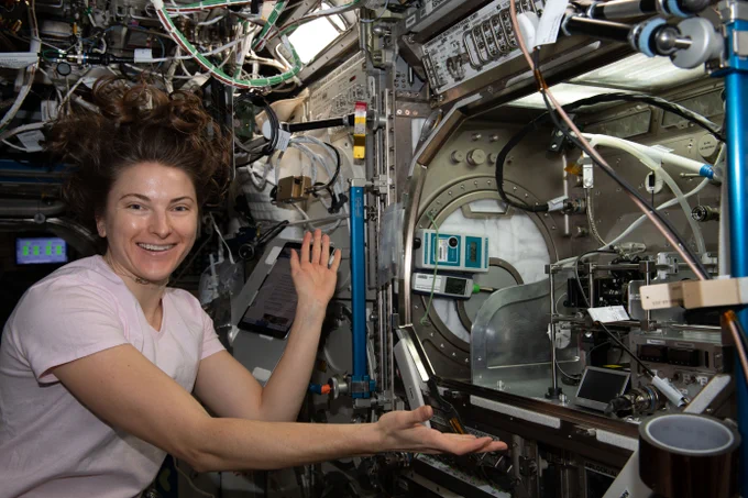 Kayla Barron sets up hardware on the International Space Station