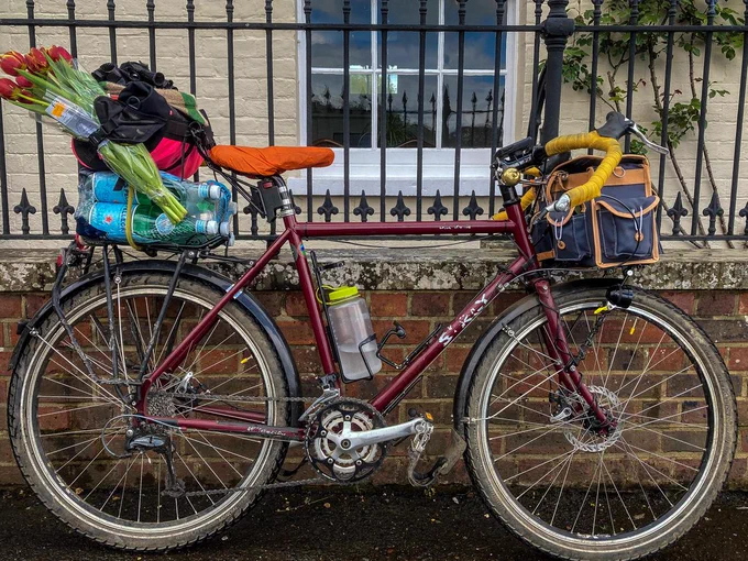 Bike loaded with shopping against wall