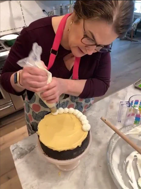 Jill Santa-Lucia of Catering Works decorating a pie