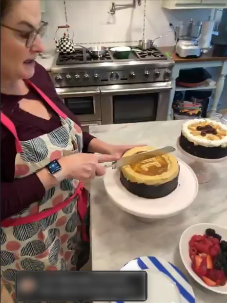 Jill Santa-Lucia of Catering Works slicing a pie