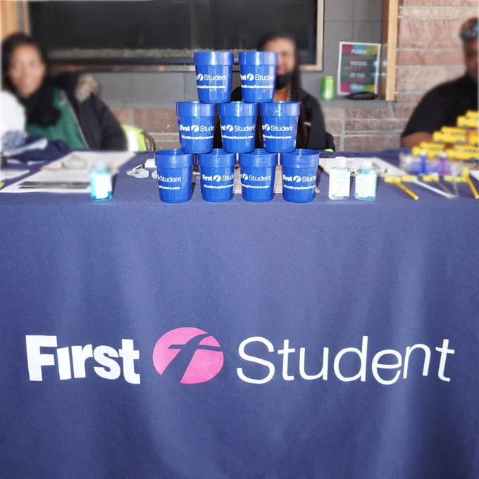 First Student workers and their stand. 
