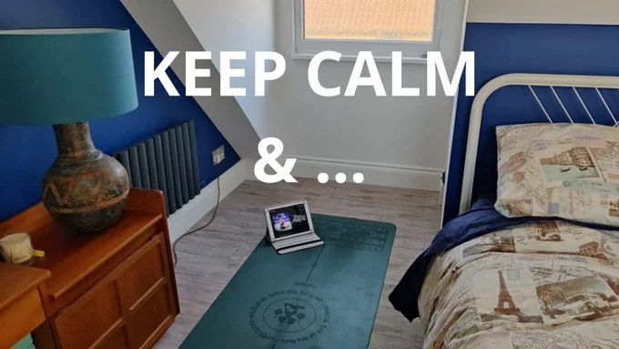 yoga mat rolled out down the side of a bed. title: keep calm &... 