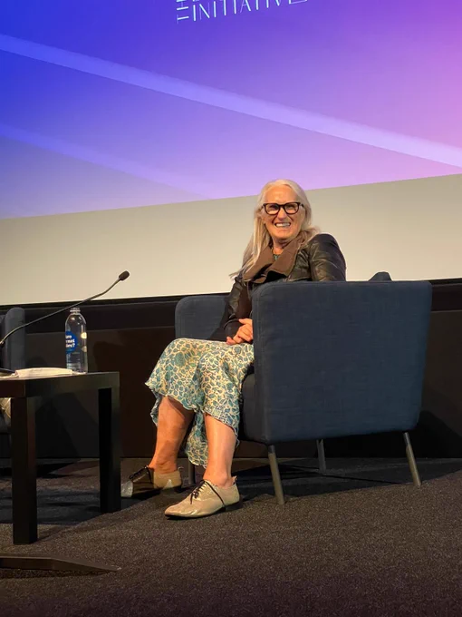 Jane Campion sat in an armchair on a stage.