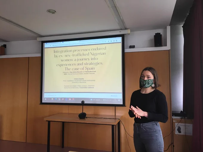 Chiara Gunella giving her presentation. Slide reads: Integration processes endured by ex-sex-trafficked Nigerian women.