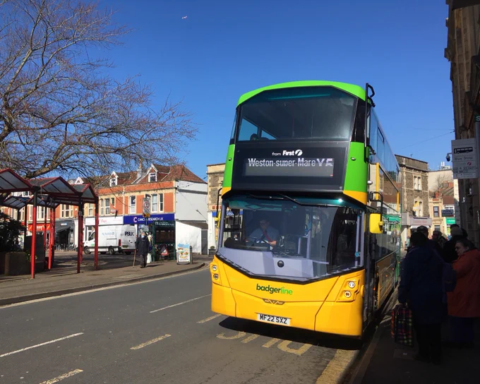 Photos of the new yellow and green Badgerline buses.