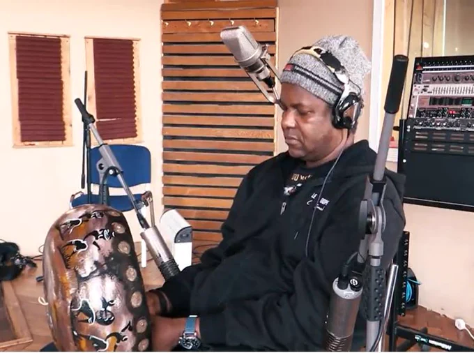 Musician playing a mbira, a traditional musical instrument from Zimbabwe. 