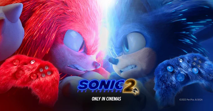 Sonic and Knuckles looking at each other ready to battle with blue and red controllers in bottom corners. 