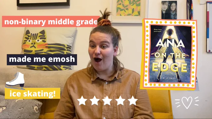 Jaz with a wide open mouth looking happy and shocked. The book Ana on the Edge by AJ Sass is on screen. There are five stars. Text reads “Non-binary middle grade. Made me emosh. Ice skating!