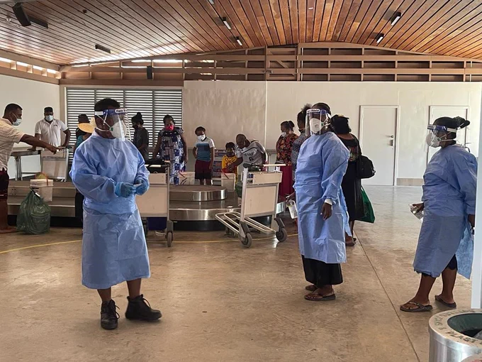 Photo of staff wearing personal protective equipment at Bonriki International Airport in Kiribati