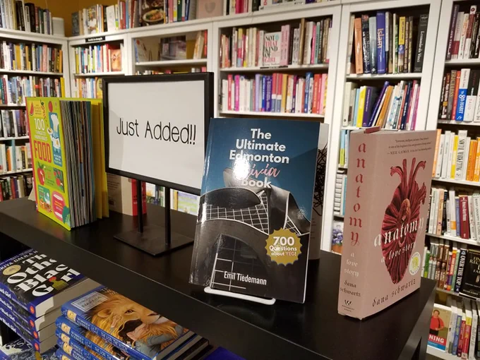 'The Ultimate Edmonton Trivia Book' on a shelf at Daisy Chain Book Co.